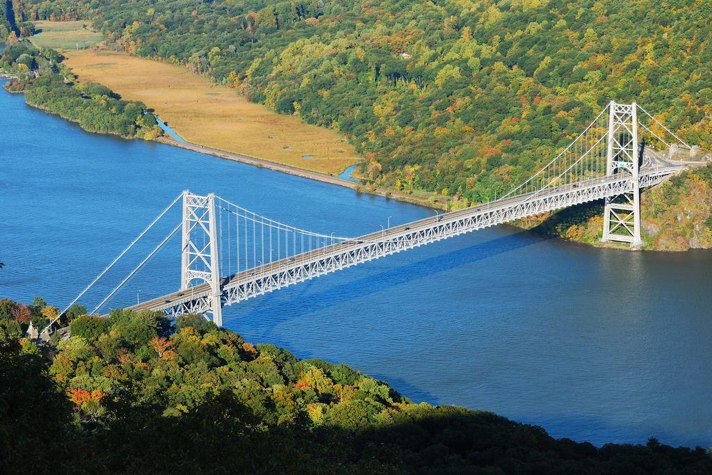 The George Washington Bridge crossing the Hudson River below the wooded Palisades cliffs in autumn colour