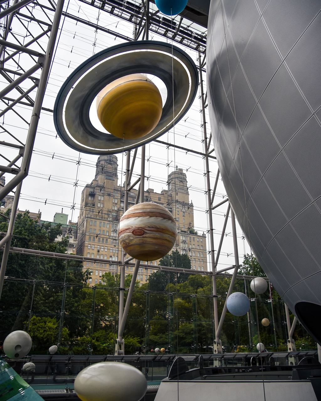 Planet models beside the Great Sphere of the Hayden Planetarium at the American Museum of Natural History, New York