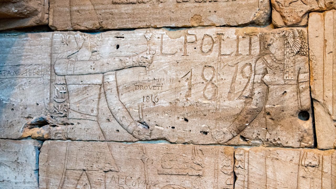Nineteenth-century visitor graffiti carved into a sandstone block of the Temple of Dendur at the Metropolitan Museum, New York